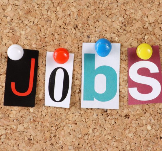 Letters for the word Jobs pinned to a bulletin board