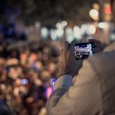 Man using phone to livestream protest