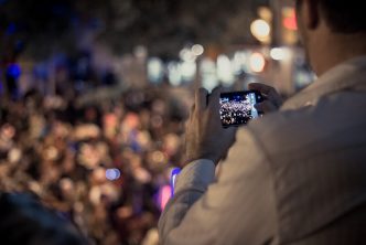 Man using phone to livestream protest