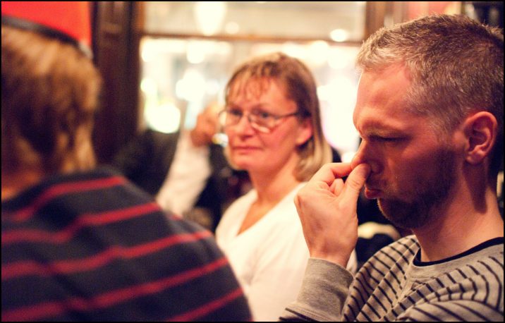 Man holding his nose - photo by Anders Adermark