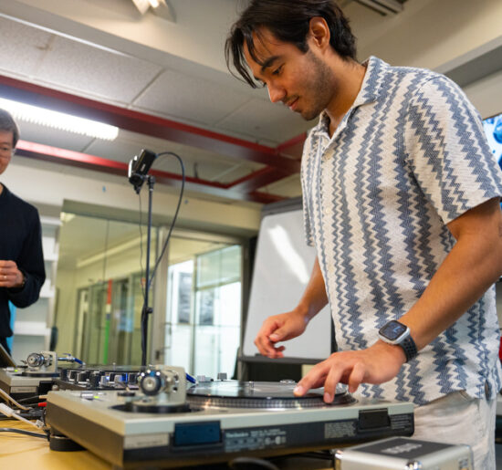 Classroom DJ station with Philip Tan and a student